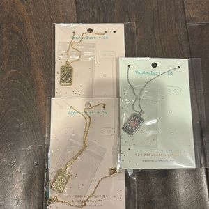 Three brand new with tags never worn wanderlust + co tarot necklaces